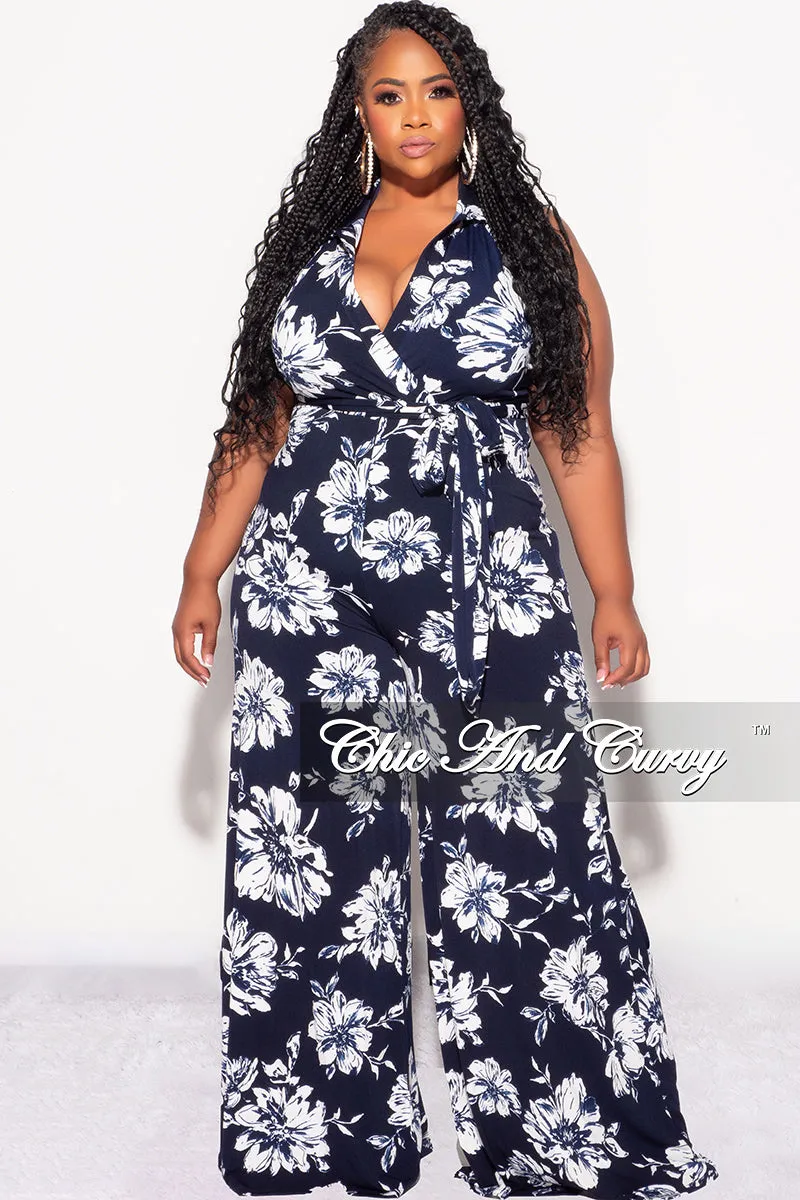 Final Sale Plus Size Faux Wrap Halter Jumpsuit with Waist Tie in Navy and White Floral Print On The Move wrinkle free
